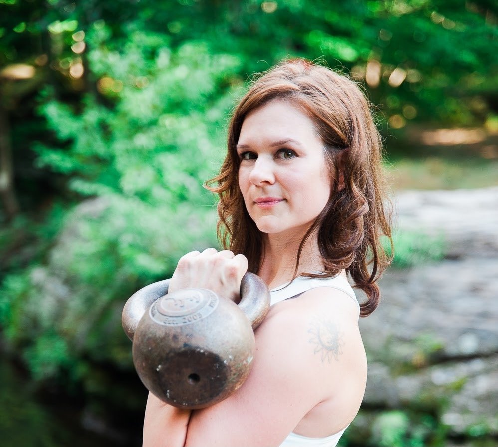 Kelly racking a vintage kettlebell